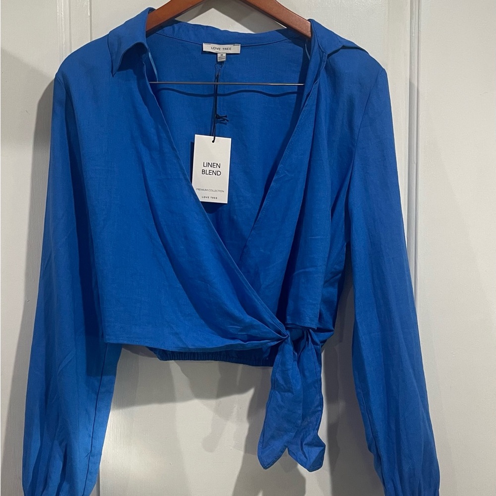 Love Tree Vibrant Blue top. Wrap around blouse size M